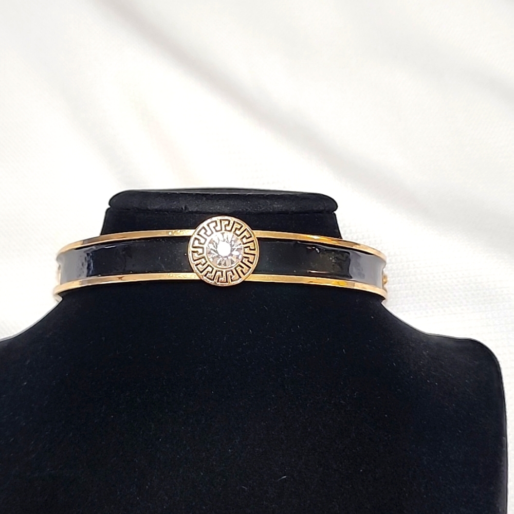Designer inspired choker Goldtone and Black with Lobster closure.